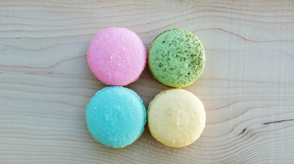 colorful cake macaron or macaroon on wooden background.
