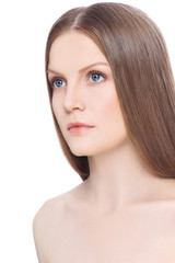 Fototapeta premium Portrait of young healthy beautiful woman with long straight hair and clean face over white background, copy space