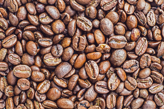 Roasted coffee beans background. Top view.