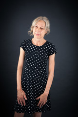 Fototapeta premium Beautiful woman doing different expressions in different sets of clothes: wink