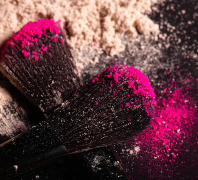 Beauty and cosmetics concept. Makeup brush on black background