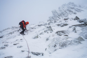 Fototapeta na wymiar Mountaineering. Teamwork in alpinism. Traverse of mountain.