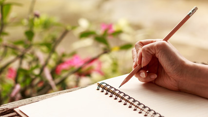 Hands of girl writing
