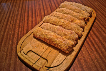 Stuffed karadjordje schnitzels on a cutting board