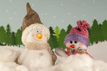 Happy snowman in winter forest.