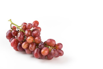 Fresh purple grapes on a white background