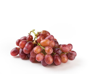 Fresh purple grapes on a white background