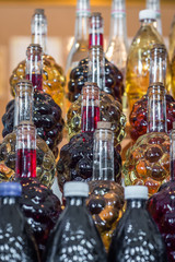 set of bottle in the form of grapes are filled with wine