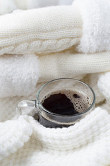 Transparent glass mug with hot coffee