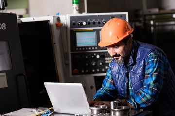 Technician working on machine.