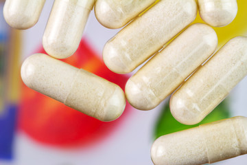 Glucosamine capsules, food supplement pills, top view, macro image.