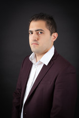 Handsome man doing different expressions in different sets of clothes: thinking