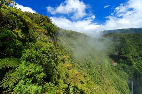 Seen on the Trou de fer waterfall on Reunion Island National Park with cloudscape, France , october 2016
