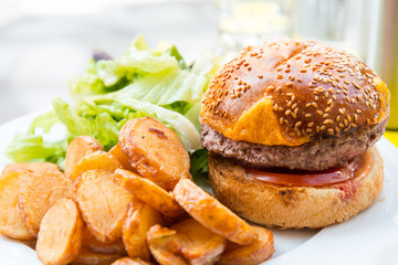 Cheese burger - American cheese burger with Golden French fries