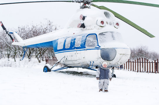 Small kid and helicopter