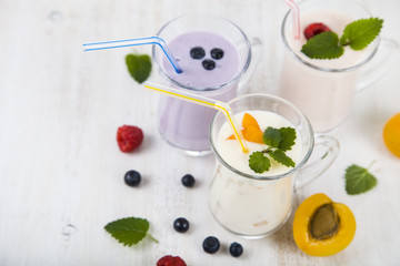 Smoothies or yogurt with fresh berries. Milkshakes with raspberr