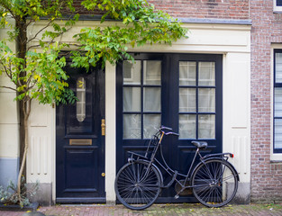 Fototapeta na wymiar ฺBicycle parking in front of a house