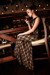 Woman sitting near bar counter