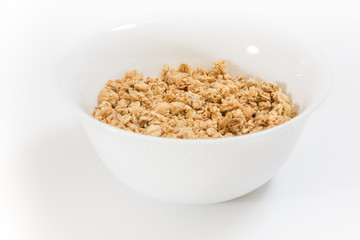 Bowl of granola, on white background.
