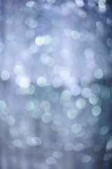 Obraz premium Glitter lights background. Holiday bokeh texture. Multicolored light. Defocused