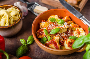 Homemade tortellini with tomato sauce