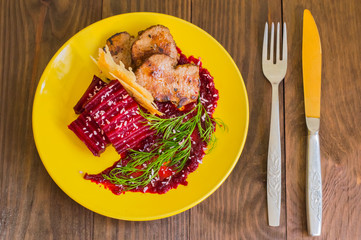 Roast beef with berry sauce, slices of cheese and chips Buriak. Wooden background. Top view