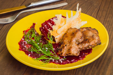 Roast beef with berry sauce, slices of cheese and chips Buriak. Wooden background. Top view
