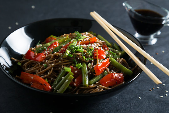 Soba with vegetables and sesame seeds. Noodles with vegetables
