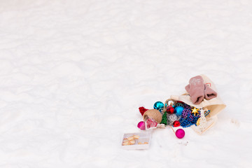 Christmas toys scattered on the snow