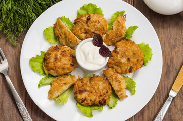 Potato pancakes for breakfast. Wooden rustic background. Top view. Close-up