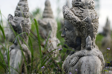 Fototapeta na wymiar The stone statue of a Buddha at Sa Kaeo; Thailand.