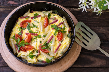 Frittata in Italian on a wooden table. Top view. Close-up