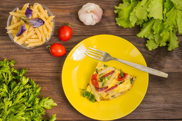 Frittata in Italian on a wooden table. Top view. Close-up