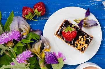 Fresh cream cake slice on a wooden table. Top view. Close-up