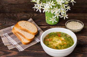 Rice soup on a wooden background. Top view