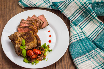 Rare Beef steak medium grilled with barbecue sauce. Wooden table. Top view. Close-up