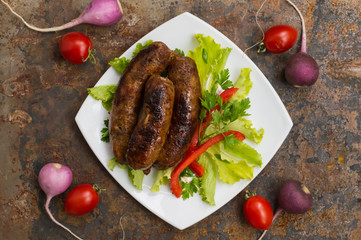 Bavarian sausages cooked on the grill. old table