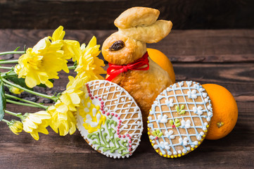 Gingerbread in the form of a rabbit and Easter eggs. Close-up