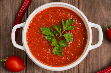 Gazpacho with vegetables. Wooden rustic background. Top view