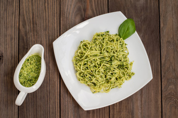 Pasta with pesto Brazilian. Wooden table. Top view