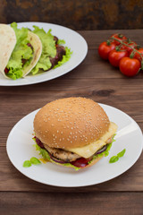 Burger of homemade close up on wooden background. Top view. -