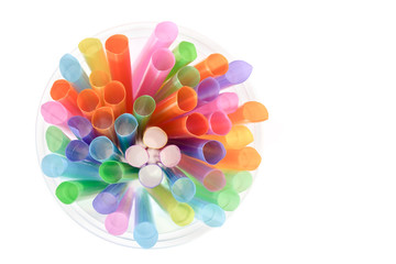 Plastic drinking straw / Plastic drinking straw on white background. Top view.