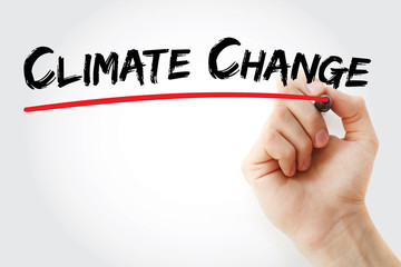 Hand writing Climate change with marker, concept background