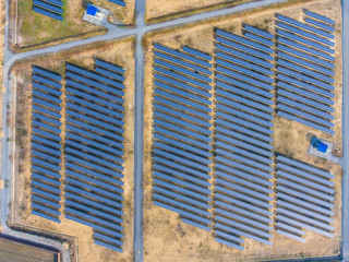 Aerial Shot of Photovoltaics Solar Farm in Rural Area, Overhead