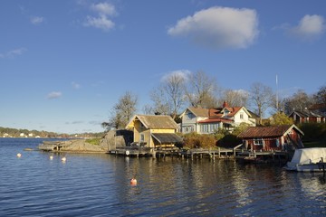 Fototapeta premium Houses by the water in Vaxholm, Stockholm archipelago.