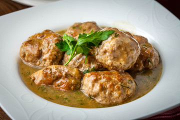 Pork meatballs with dill sauce.