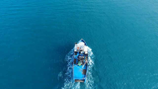 Samll fishing boat at sea - Aerial footage