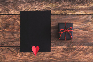 Black greeting card or valentines letter  and gift.