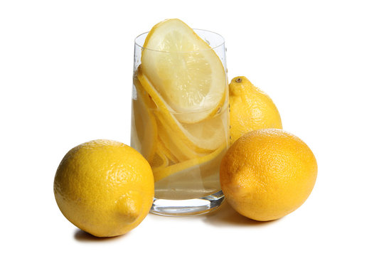 Lemon juice in a glass goblet on a white background