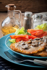Crispy fried homemade potato pancakes with mushroom sauce.